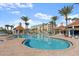 Community pool with cabana and lounge chairs at 4628 Harbour Village Blvd # 2206, Ponce Inlet, FL 32127