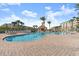 Community pool with plenty of lounge chairs at 4628 Harbour Village Blvd # 2206, Ponce Inlet, FL 32127