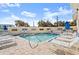 Inviting community pool with lounge chairs and umbrellas at 4628 Harbour Village Blvd # 2206, Ponce Inlet, FL 32127