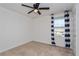 Bedroom with black and white curtains and ceiling fan at 4825 Apple Blossom Ln, Saint Cloud, FL 34771