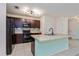 Modern kitchen featuring dark wood cabinets and a large island at 4825 Apple Blossom Ln, Saint Cloud, FL 34771