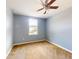 Spacious bedroom with neutral walls, carpeting, and ceiling fan at 526 Mount Olympus Blvd, New Smyrna Beach, FL 32168