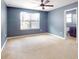 Spacious bedroom with ceiling fan and neutral carpeting at 526 Mount Olympus Blvd, New Smyrna Beach, FL 32168