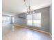 Simple dining room with tile floors and a chandelier at 526 Mount Olympus Blvd, New Smyrna Beach, FL 32168