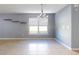 Bright dining room with tile floors and a chandelier at 526 Mount Olympus Blvd, New Smyrna Beach, FL 32168