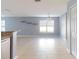 Open dining area with tile floors and a view into the kitchen at 526 Mount Olympus Blvd, New Smyrna Beach, FL 32168