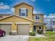 Two-story townhome with two-car garage and landscaped yard at 526 Mount Olympus Blvd, New Smyrna Beach, FL 32168