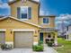 Two-story townhome with two-car garage and landscaped yard at 526 Mount Olympus Blvd, New Smyrna Beach, FL 32168