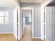 Hallway connecting bedrooms with neutral walls and carpet at 526 Mount Olympus Blvd, New Smyrna Beach, FL 32168