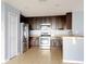 Modern kitchen with stainless steel appliances and dark wood cabinets at 526 Mount Olympus Blvd, New Smyrna Beach, FL 32168