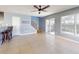 Living area with tile floors, ceiling fan and access to the outdoors at 526 Mount Olympus Blvd, New Smyrna Beach, FL 32168