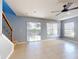 Living area with sliding doors leading to the backyard at 526 Mount Olympus Blvd, New Smyrna Beach, FL 32168