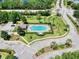 Community pool with surrounding landscaping and cabana at 526 Mount Olympus Blvd, New Smyrna Beach, FL 32168