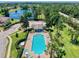 Community pool and cabana nestled in lush landscaping at 526 Mount Olympus Blvd, New Smyrna Beach, FL 32168