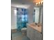 Clean bathroom with a shower/tub combo and white vanity at 5300 S Atlantic Ave # 16201, New Smyrna Beach, FL 32169