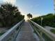 Scenic wooden walkway to the beach at 5300 S Atlantic Ave # 16201, New Smyrna Beach, FL 32169