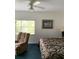 Main bedroom with king-size bed and ceiling fan at 5300 S Atlantic Ave # 16201, New Smyrna Beach, FL 32169