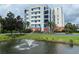 Three-story building with water feature at 5300 S Atlantic Ave # 16201, New Smyrna Beach, FL 32169