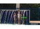 Children playing in the pool's waterfall at 5300 S Atlantic Ave # 16201, New Smyrna Beach, FL 32169