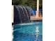 Refreshing pool with a waterfall feature at 5300 S Atlantic Ave # 16201, New Smyrna Beach, FL 32169