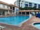 Inviting community pool with lounge chairs and spa at 5300 S Atlantic Ave # 16201, New Smyrna Beach, FL 32169