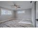 Bright bedroom with wood-look floors, and ceiling fan at 555 Wildwood Dr, New Smyrna Beach, FL 32168