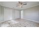 Spacious bedroom with double doors and wood-look floors at 555 Wildwood Dr, New Smyrna Beach, FL 32168