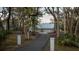 Home with long driveway, nestled amongst mature trees at 555 Wildwood Dr, New Smyrna Beach, FL 32168