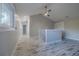 Bright hallway with vaulted ceiling, wood-look floors, and access to bedrooms at 555 Wildwood Dr, New Smyrna Beach, FL 32168