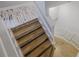 Unique staircase with a rustic wood and white design at 555 Wildwood Dr, New Smyrna Beach, FL 32168