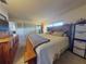 Spacious primary bedroom featuring a king-size bed and wood furniture at 660 Biscayne Dr, Orange City, FL 32763