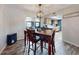 Bright dining area with wooden table and view into kitchen at 660 Biscayne Dr, Orange City, FL 32763