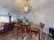 Dining area with wooden table and chairs near living room at 660 Biscayne Dr, Orange City, FL 32763