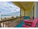 Balcony overlooking the ocean with seating for two at 6612 S Atlantic Ave # 2010, New Smyrna Beach, FL 32169