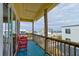 Balcony with ocean view and seating area at 6612 S Atlantic Ave # 201, New Smyrna Beach, FL 32169