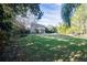 Large backyard with grassy area and home view at 6932 Vintage Ln, Port Orange, FL 32128