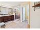Primary bathroom with double sinks, a large shower, and tile floors at 6932 Vintage Ln, Port Orange, FL 32128