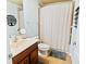 Full bathroom with tub/shower combo and wood vanity at 6932 Vintage Ln, Port Orange, FL 32128