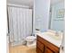 Clean bathroom, shower/tub combo, wood vanity at 6932 Vintage Ln, Port Orange, FL 32128