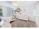 Bright bedroom with white furniture and leafy decor at 6932 Vintage Ln, Port Orange, FL 32128