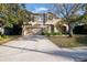 Two-story house with a driveway and attached garage at 6932 Vintage Ln, Port Orange, FL 32128