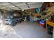 Spacious garage with golf cart, storage, and work bench at 6932 Vintage Ln, Port Orange, FL 32128