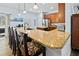 Kitchen with granite countertop breakfast bar and modern appliances at 6932 Vintage Ln, Port Orange, FL 32128