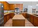 Modern kitchen with granite countertop island and stainless steel appliances at 6932 Vintage Ln, Port Orange, FL 32128