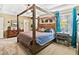 Main bedroom with a large four-poster bed and carpeted floor at 6932 Vintage Ln, Port Orange, FL 32128