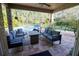 Covered patio with seating area and view of the pool at 6932 Vintage Ln, Port Orange, FL 32128