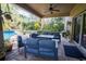 Covered patio furniture with fire pit overlooking the pool at 6932 Vintage Ln, Port Orange, FL 32128