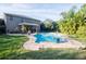 Inviting kidney shaped pool with brick patio at 6932 Vintage Ln, Port Orange, FL 32128