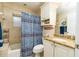 Simple bathroom with a shower/tub combo and granite vanity at 701 N Atlantic Ave # 102, New Smyrna Beach, FL 32169