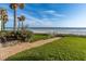 Convenient beach access with grassy area and walkway at 701 N Atlantic Ave # 102, New Smyrna Beach, FL 32169